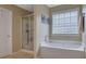 Bathroom with a garden tub and a separate shower at 1403 Shiloh Oak Dr, Loganville, GA 30052