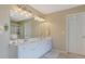 Double vanity bathroom with a large mirror and plenty of counter space at 1403 Shiloh Oak Dr, Loganville, GA 30052