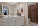 Bathroom with a single vanity and a shower/tub combo at 1403 Shiloh Oak Dr, Loganville, GA 30052