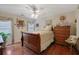 Bedroom with hardwood floors and a wooden dresser at 1403 Shiloh Oak Dr, Loganville, GA 30052