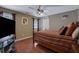 Bedroom with hardwood floors and a large TV at 1403 Shiloh Oak Dr, Loganville, GA 30052