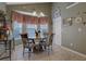 Charming breakfast nook with round table and chairs, and bay window at 1403 Shiloh Oak Dr, Loganville, GA 30052