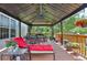 Relaxing deck with gazebo, seating, and potted plants at 1403 Shiloh Oak Dr, Loganville, GA 30052