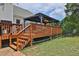 Wooden deck with gazebo, stairs, and fenced yard at 1403 Shiloh Oak Dr, Loganville, GA 30052