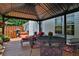 Covered deck features a dining set and comfortable seating at 1403 Shiloh Oak Dr, Loganville, GA 30052