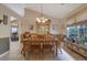 Spacious dining area featuring a large wood table, hutch, and wood floors at 1403 Shiloh Oak Dr, Loganville, GA 30052