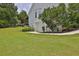 House exterior with grassy yard and storage area at 1403 Shiloh Oak Dr, Loganville, GA 30052