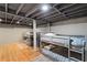 Finished basement with multiple bunk beds and hardwood floors at 15 E Georgia Ave, Emerson, GA 30137