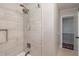 Updated bathroom with a shower/tub combo, tile surround, and modern fixtures at 15 E Georgia Ave, Emerson, GA 30137