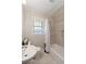 Clean bathroom with a shower/tub, pedestal sink, and window at 15 E Georgia Ave, Emerson, GA 30137
