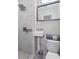 Modern bathroom with a walk-in shower, floating vanity, and stylish mirror at 15 E Georgia Ave, Emerson, GA 30137