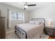 Bright bedroom featuring a queen bed, ceiling fan, and hardwood floors at 15 E Georgia Ave, Emerson, GA 30137