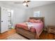 Main bedroom with king-size bed, ensuite bathroom access, and hardwood floors at 15 E Georgia Ave, Emerson, GA 30137