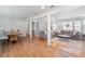 Open dining room with hardwood floors and a rustic wooden dining table at 15 E Georgia Ave, Emerson, GA 30137