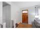 Bright entryway with hardwood floors and a charming wooden front door at 15 E Georgia Ave, Emerson, GA 30137