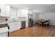 Modern kitchen with white shaker cabinets, stainless steel appliances, and granite countertops at 15 E Georgia Ave, Emerson, GA 30137