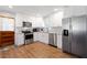 Updated kitchen featuring white cabinets, stainless steel appliances, and granite countertops at 15 E Georgia Ave, Emerson, GA 30137