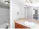Bathroom featuring a white sink, brown countertop, and shower/tub combo at 8690 Ashley Way, Douglasville, GA 30134