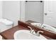 Bathroom featuring a white sink, brown countertop, and large mirror at 8690 Ashley Way, Douglasville, GA 30134