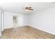 Bright, open living room with wood flooring and sliding door access to the yard at 8690 Ashley Way, Douglasville, GA 30134