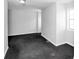Spacious living room featuring a large window and neutral paint at 8690 Ashley Way, Douglasville, GA 30134