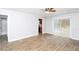 Spacious living room featuring wood floors and sliding glass door access to the backyard at 8690 Ashley Way, Douglasville, GA 30134