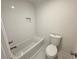 Clean and bright bathroom features white subway tile and updated fixtures at 9240 Prestwick Club Dr, Duluth, GA 30097