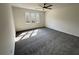 Bedroom with ceiling fan and natural light from a window at 9240 Prestwick Club Dr, Duluth, GA 30097