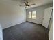 This bedroom features neutral walls, plush gray carpeting, and a modern ceiling fan at 9240 Prestwick Club Dr, Duluth, GA 30097