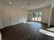 Dining room featuring modern light fixture, wainscotting, and large windows at 9240 Prestwick Club Dr, Duluth, GA 30097