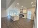 Spacious kitchen with stainless steel appliances, large island, custom cabinets, and modern fixtures at 9240 Prestwick Club Dr, Duluth, GA 30097