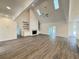 Bright living room featuring vaulted ceilings, wood floors, fireplace and open concept design at 9240 Prestwick Club Dr, Duluth, GA 30097