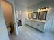 Spacious bathroom featuring dual sink vanity and attractive tile flooring at 9240 Prestwick Club Dr, Duluth, GA 30097