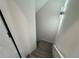 A well-lit staircase showcases modern lighting fixtures and newly installed carpeting at 9240 Prestwick Club Dr, Duluth, GA 30097