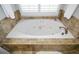 Oval soaking tub with tile surround at 3034 Ironhill Way, Woodstock, GA 30189