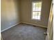 Simple bedroom with neutral walls and carpet flooring at 380 River Trace Dr, Villa Rica, GA 30180