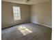 Spacious bedroom with carpet and large window at 380 River Trace Dr, Villa Rica, GA 30180