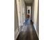 Long hallway with light walls and dark hardwood floors at 380 River Trace Dr, Villa Rica, GA 30180