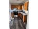 Galley kitchen with wood cabinets and stainless steel appliances at 380 River Trace Dr, Villa Rica, GA 30180