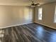 Spacious living room with hardwood floors and ceiling fan at 380 River Trace Dr, Villa Rica, GA 30180