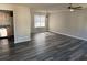 Open living area with hardwood floors and kitchen view at 380 River Trace Dr, Villa Rica, GA 30180