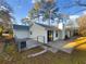 Home features a patio and fenced backyard at 4095 Maxanne Nw Dr, Kennesaw, GA 30144