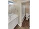 Clean bathroom with a tub shower combo and white vanity at 4095 Maxanne Nw Dr, Kennesaw, GA 30144