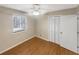 Bright bedroom with wood flooring, ceiling fan and closet at 4095 Maxanne Nw Dr, Kennesaw, GA 30144