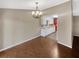 Simple dining room with hardwood floors and chandelier at 4095 Maxanne Nw Dr, Kennesaw, GA 30144