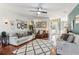 Light-filled living room with hardwood floors, neutral decor, and comfortable seating at 659 Jackson St, Suwanee, GA 30024