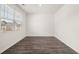 Bedroom with white walls, hardwood floors and a large window at 185 Amberjack Trail, Covington, GA 30016