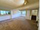 Finished basement with neutral carpeting and ample space at 1906 Young Rd, Lithonia, GA 30058