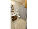 Clean bathroom with shower/tub combo and updated vanity at 1906 Young Rd, Lithonia, GA 30058