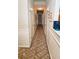 Long hallway with neutral walls and carpeted floors at 1906 Young Rd, Lithonia, GA 30058